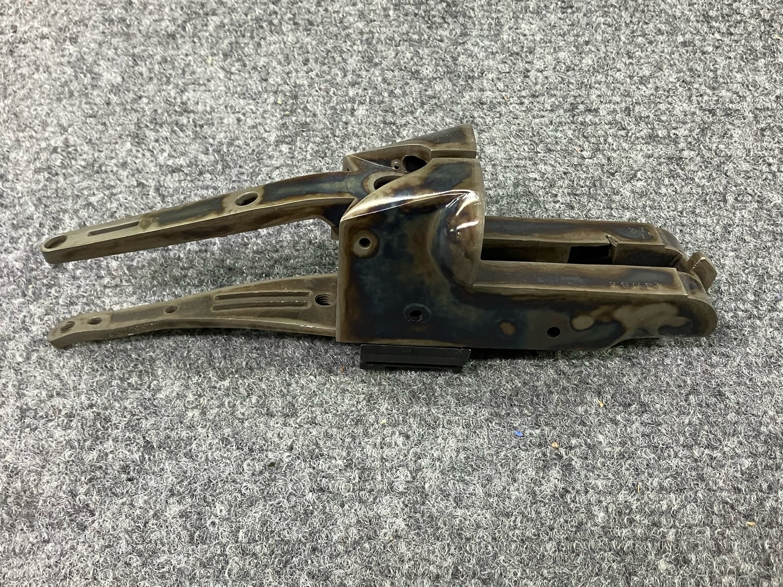 Color case-hardened receiver with tangs, oriented left to right