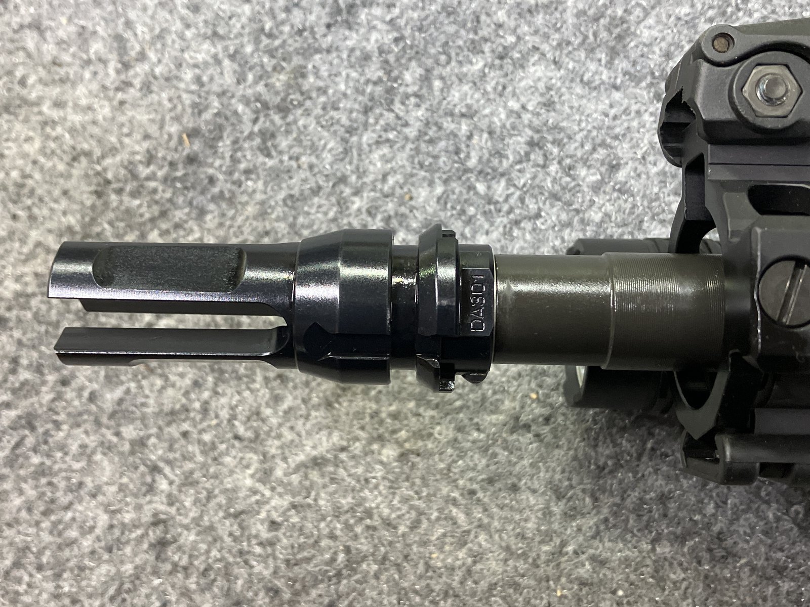 Side view of pinned muzzle device at the 3 o'clock position