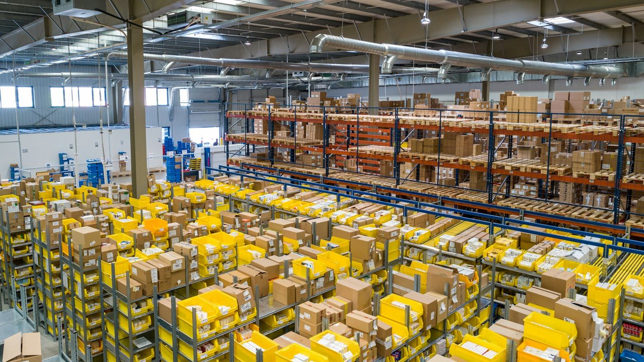 Warehouse shelves with cardboard boxes ready for shipment