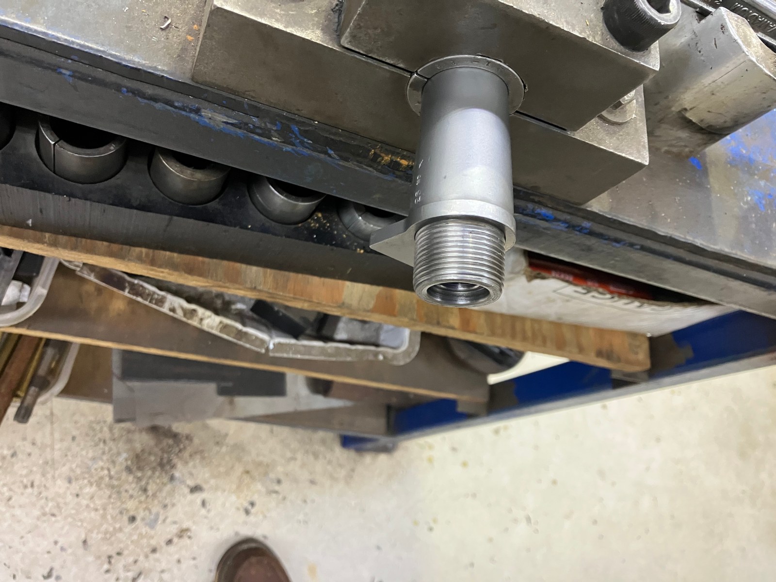 Cleaning muzzle threads, the barrel shoulder, and both sides of the recoil lug before the barrel goes back on the action