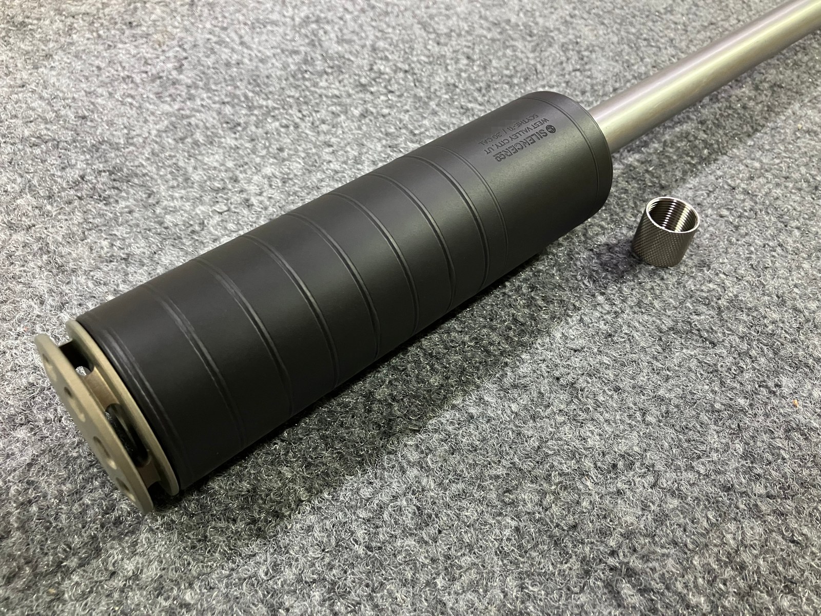Another view of the finished barrel with the customer's suppressor installed, serial obscured