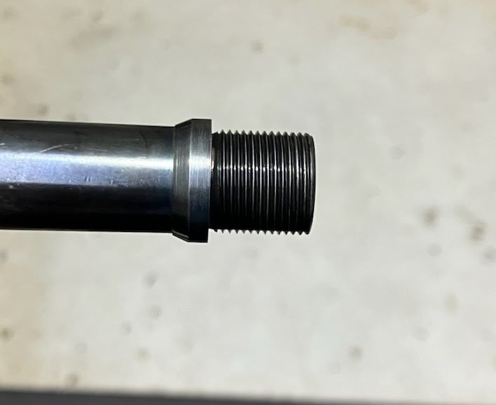 Cold-blued shoulder-expanding collar off the lathe, matching the barrel, with threads ahead of the collar